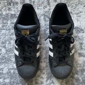 Adidas black and white Superstar sneakers